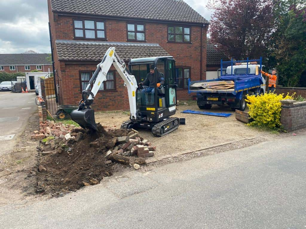 This is a photo of an operative of Downham Market Driveways Digging out for a new tarmac driveway