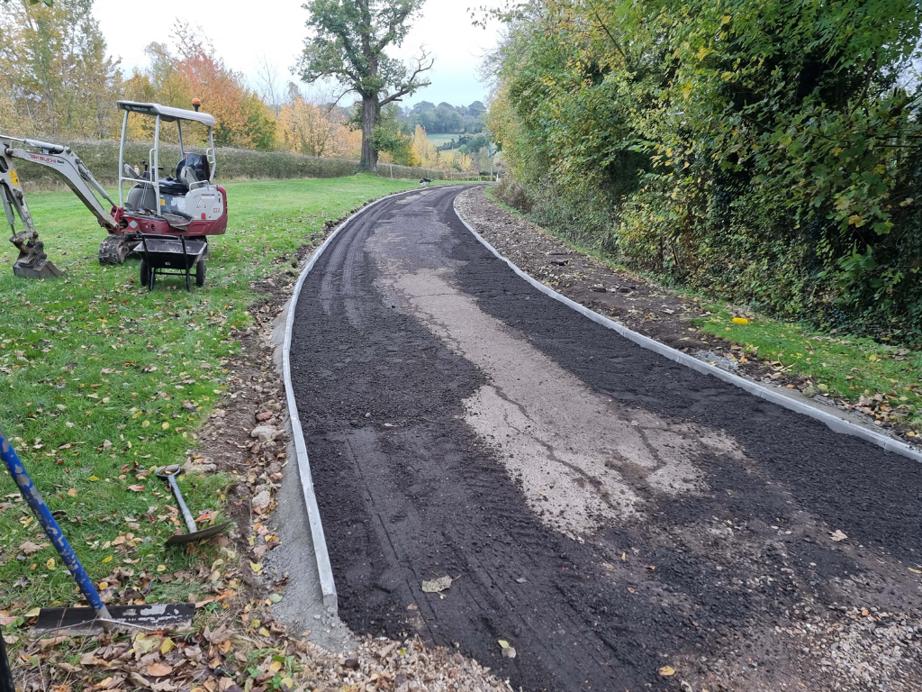 This is a large driveway which is in the process of having a tar and chip driveway installed on by Downham Market Driveways