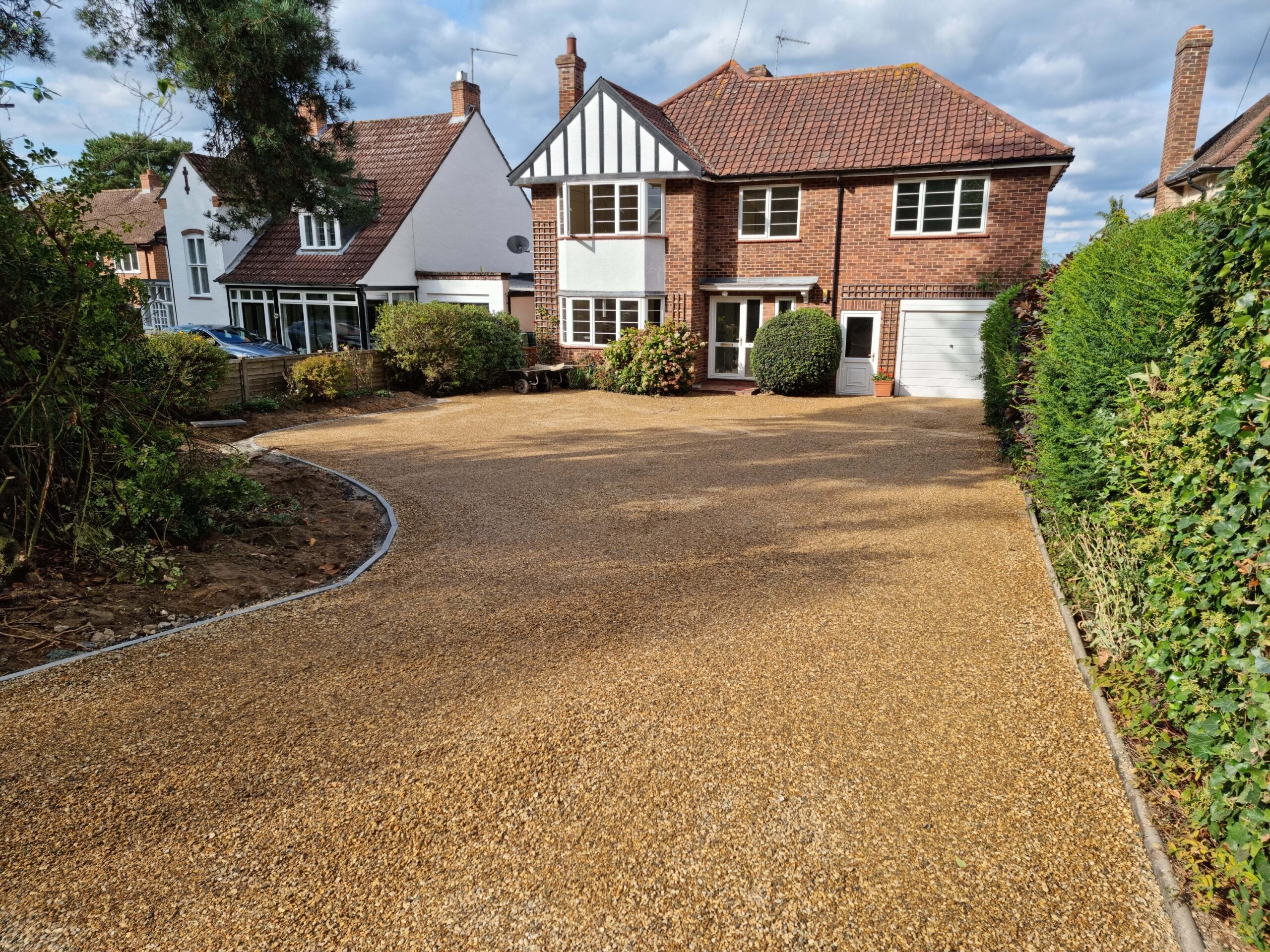 This is a newly installed tar and chip driveway installed by Downham Market Driveways